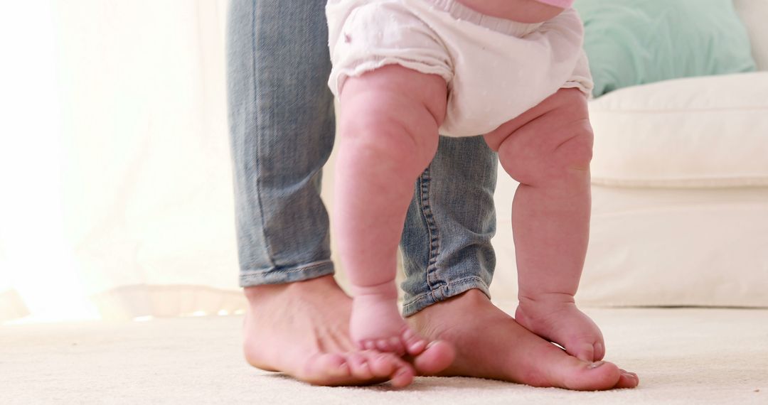 Parent Helping Baby Take First Steps at Home - Free Images, Stock Photos and Pictures on Pikwizard.com