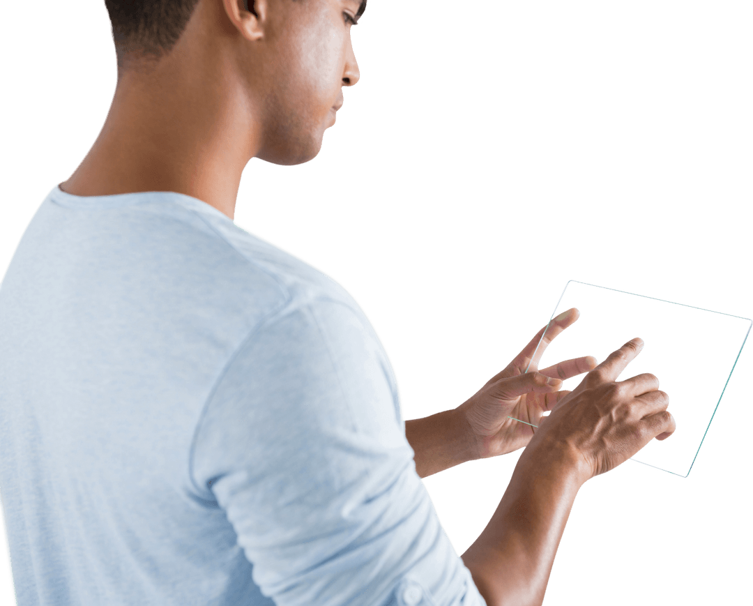 Side View of Young Man Interacting with Transparent Digital Tablet