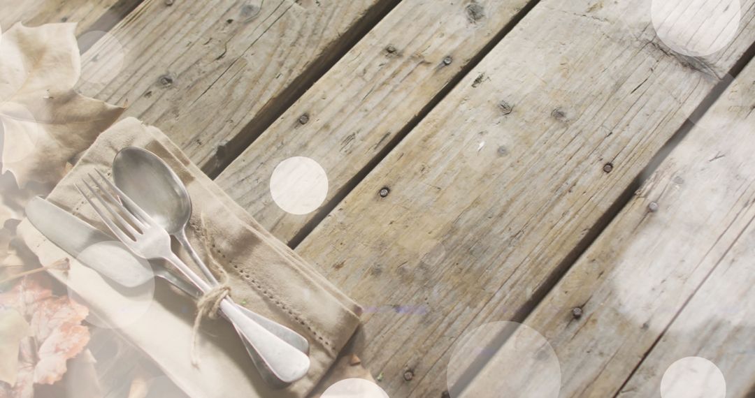 Wooden Table with Silverware and Soft Light Globes