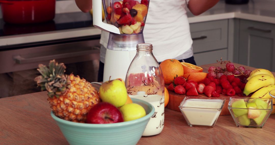 Person Preparing Healthy Smoothie with Fresh Fruit - Free Images, Stock Photos and Pictures on Pikwizard.com