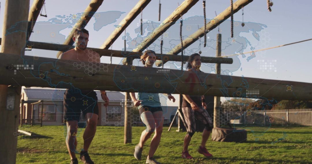 Team carrying heavy log during outdoor obstacle course endurance challenge