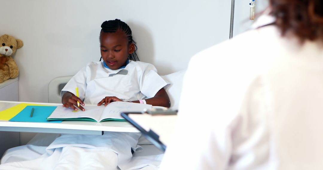 Young African American girl studying in hospital bed - Free Images, Stock Photos and Pictures on Pikwizard.com