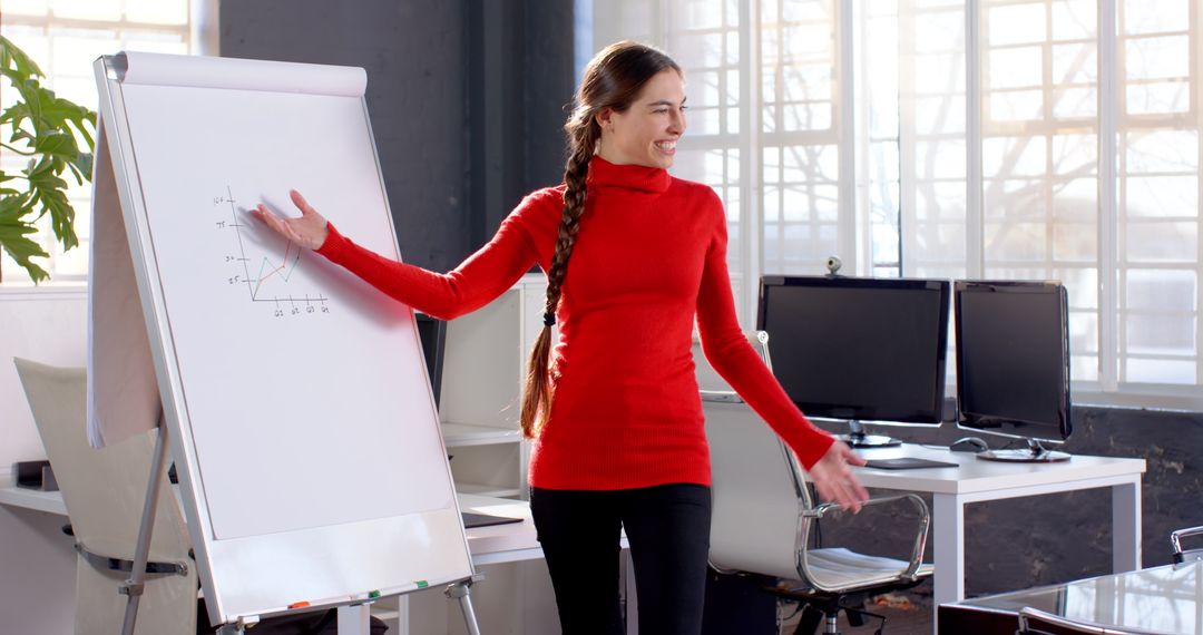 Smiling Businesswoman Presenting to Colleagues in Modern Office