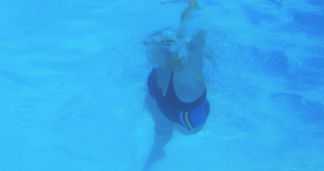 Underwater Shot of a Swimmer Performing Backstroke - Free Images, Stock Photos and Pictures on Pikwizard.com