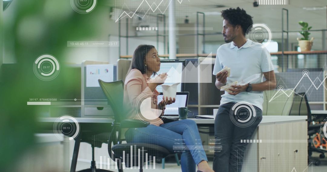 Diverse Colleagues Analyzing Data in Modern Office Space