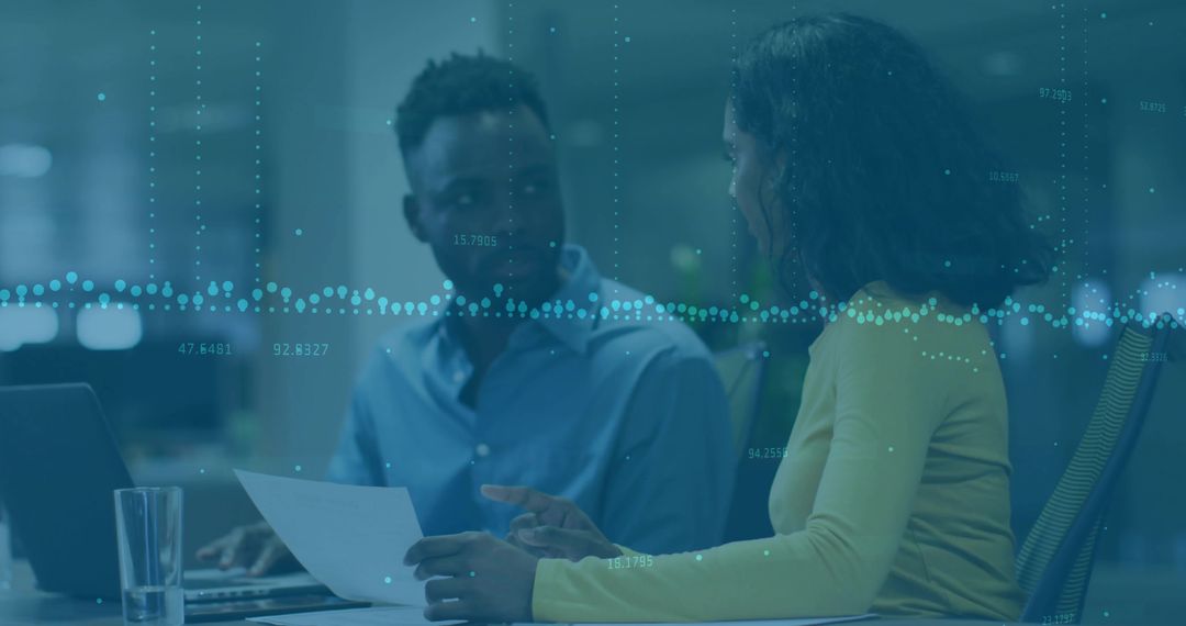 Business Partners Discuss Data Analytics with Digital Assets