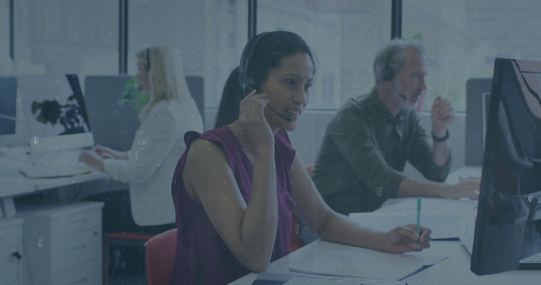 Diverse Team in Office Analyzing Financial Data on Computers