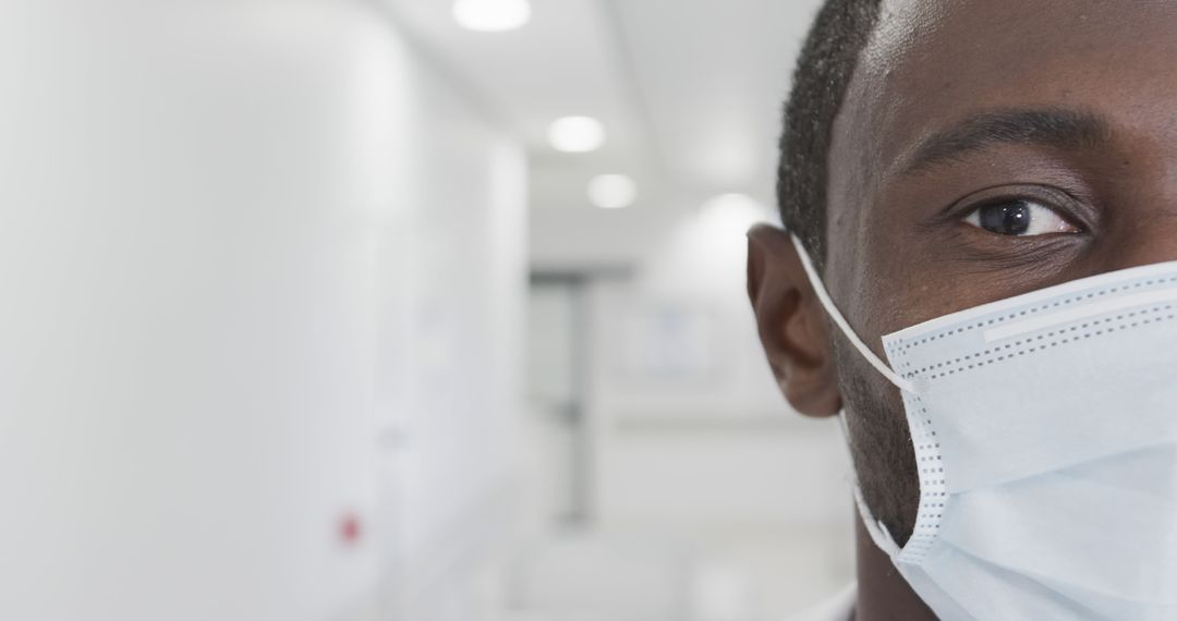 Close-Up of Healthcare Worker Wearing Surgical Face Mask in Hospital - Free Images, Stock Photos and Pictures on Pikwizard.com