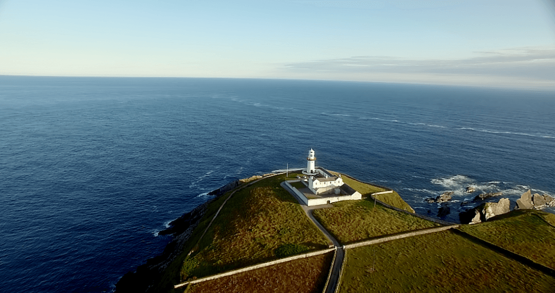 Transparent Lush Hill and Lighthouse Overlooking Vast Sea