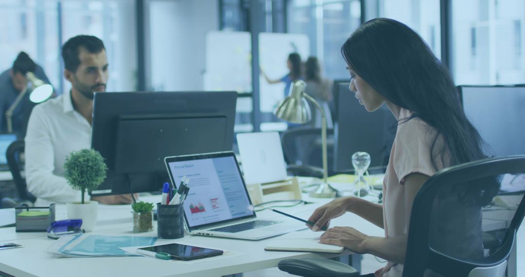 Woman Collaborating in Modern Office with Technology