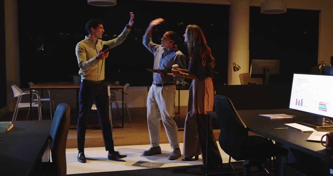 Diverse Team Collaborating in Office During Night Meeting