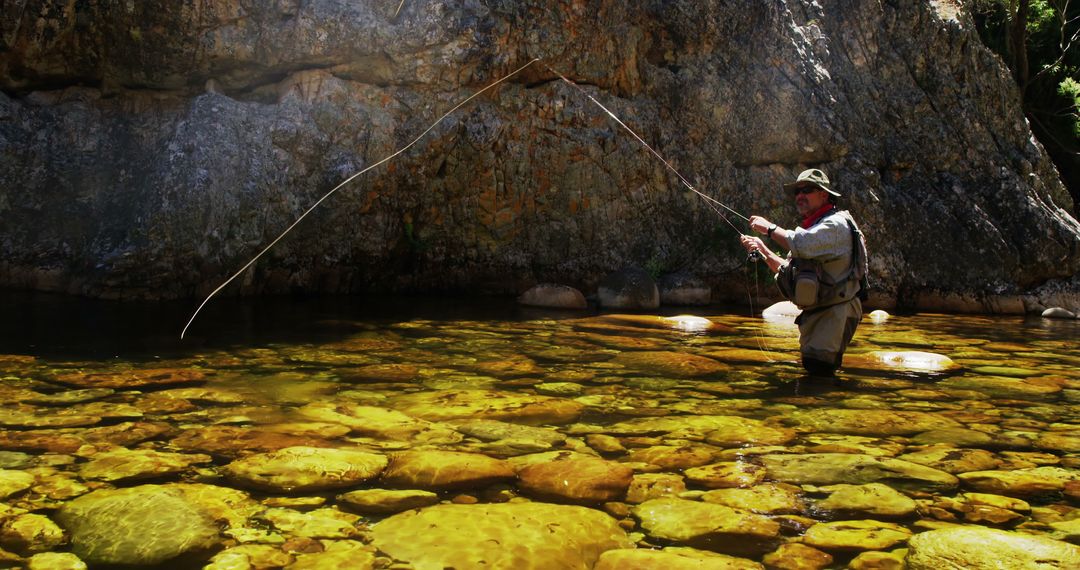 Fisherman Fly Fishing in Rocky River - Free Images, Stock Photos and Pictures on Pikwizard.com