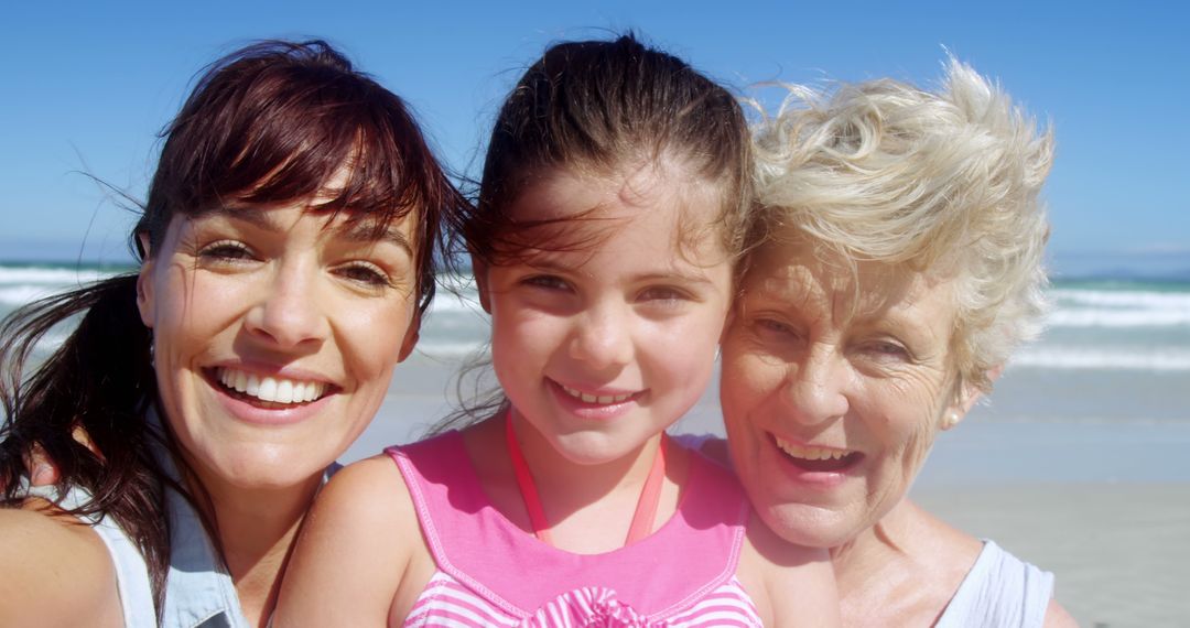 Three Generations of Women Smiling at the Beach on Sunny Day - Free Images, Stock Photos and Pictures on Pikwizard.com