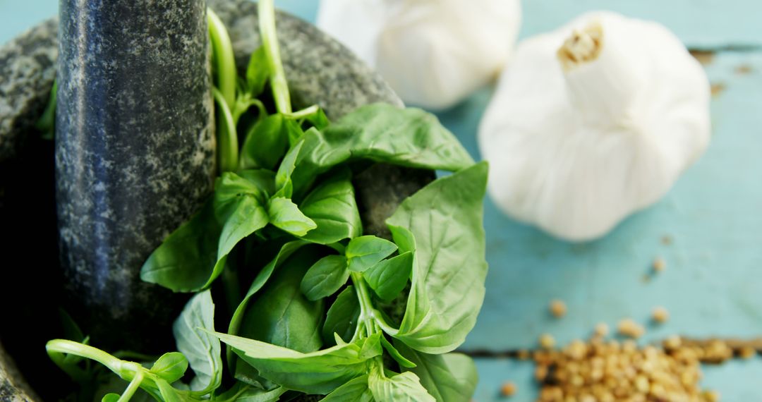 Fresh Basil and Garlic on Rustic Wooden Surface - Free Images, Stock Photos and Pictures on Pikwizard.com