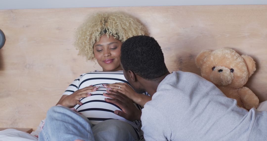 Expectant Parents Embracing Bond with Unborn Child in Cozy Moment