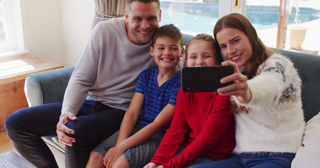 Happy Family Taking Selfie Together on Couch - Free Images, Stock Photos and Pictures on Pikwizard.com