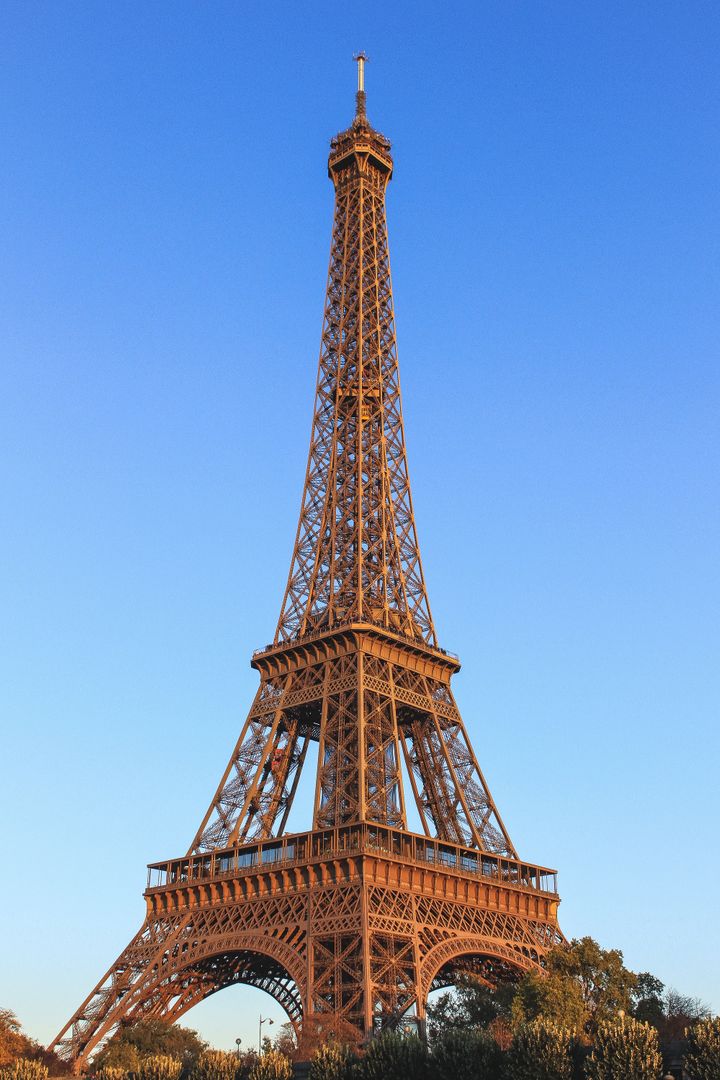Eiffel Tower Against Clear Blue Sky During Sunset - Free Images, Stock Photos and Pictures on Pikwizard.com