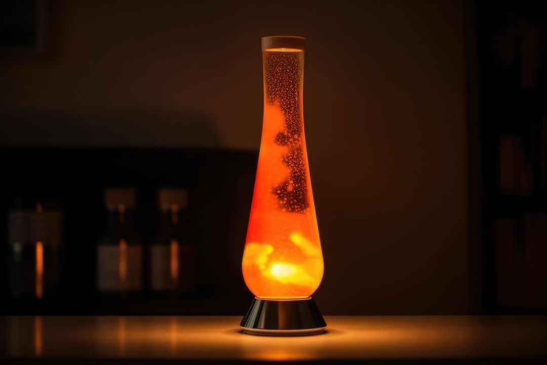 Orange lava lamp on table in dark room at night, created using generative ai technology - Free Images, Stock Photos and Pictures on Pikwizard.com