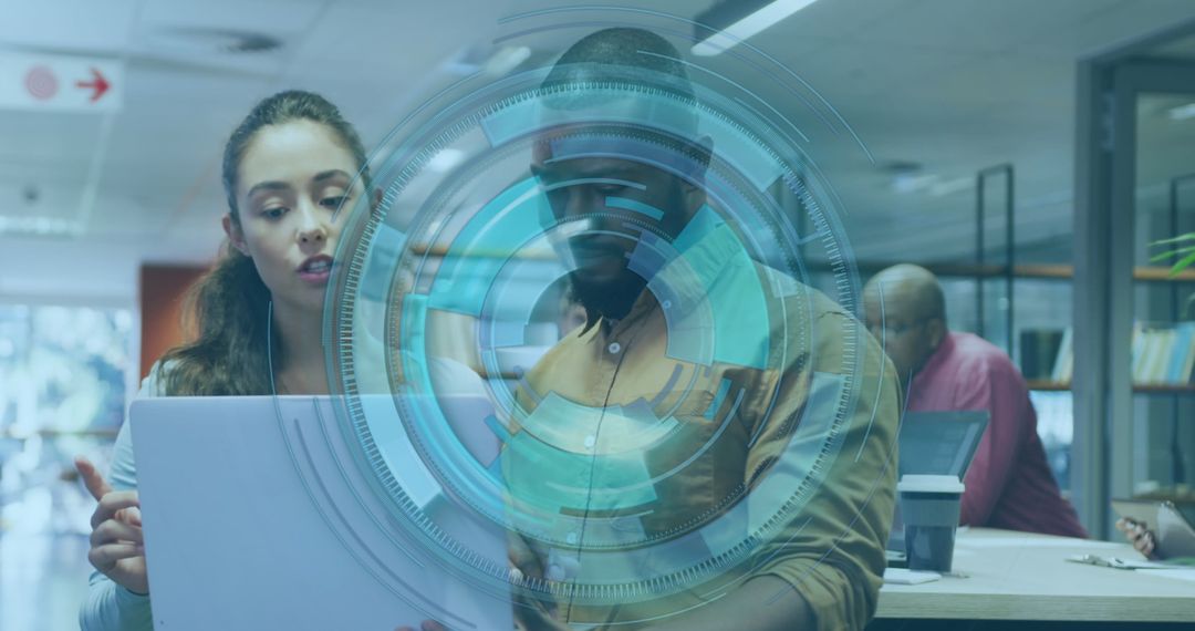 Colleagues Discussing Project with Holographic Interface in Modern Office