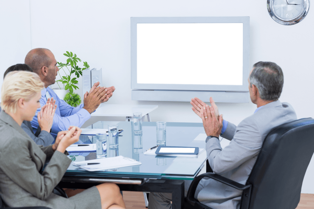 Business Team Applauding Video Presentation on Transparent Screen