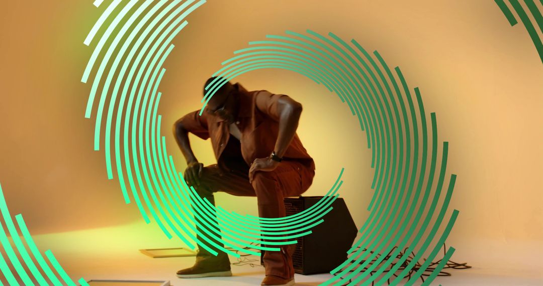 Crouching Modern Performer in Artistic Studio Environment