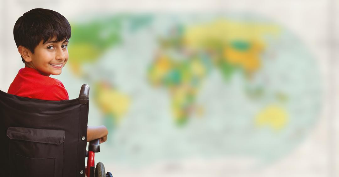 Smiling Boy in Wheelchair with World Map Background - Free Images, Stock Photos and Pictures on Pikwizard.com