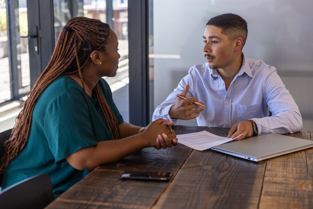 Diverse Coworkers Collaborating in Modern Office at Conference Table