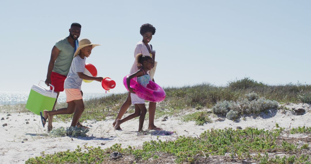 African American Family Enjoying Sunny Vacation at Beach - Free Images, Stock Photos and Pictures on Pikwizard.com