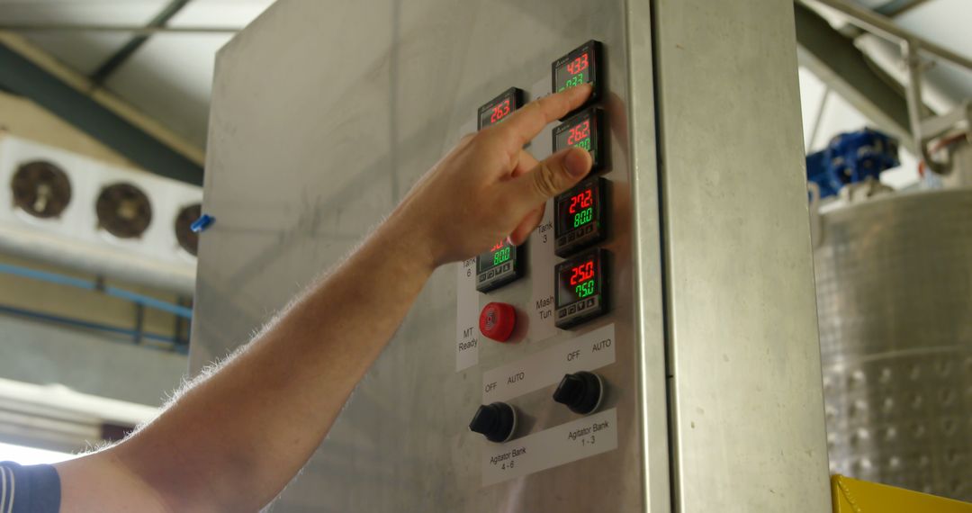 Engineer Adjusting Machine Control Panel On Factory Floor - Free Images, Stock Photos and Pictures on Pikwizard.com