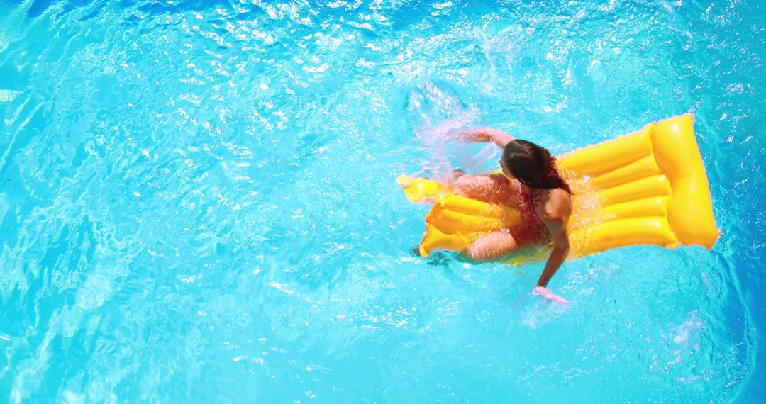 Woman Relaxing on Yellow Float in Sparkling Blue Pool - Free Images, Stock Photos and Pictures on Pikwizard.com