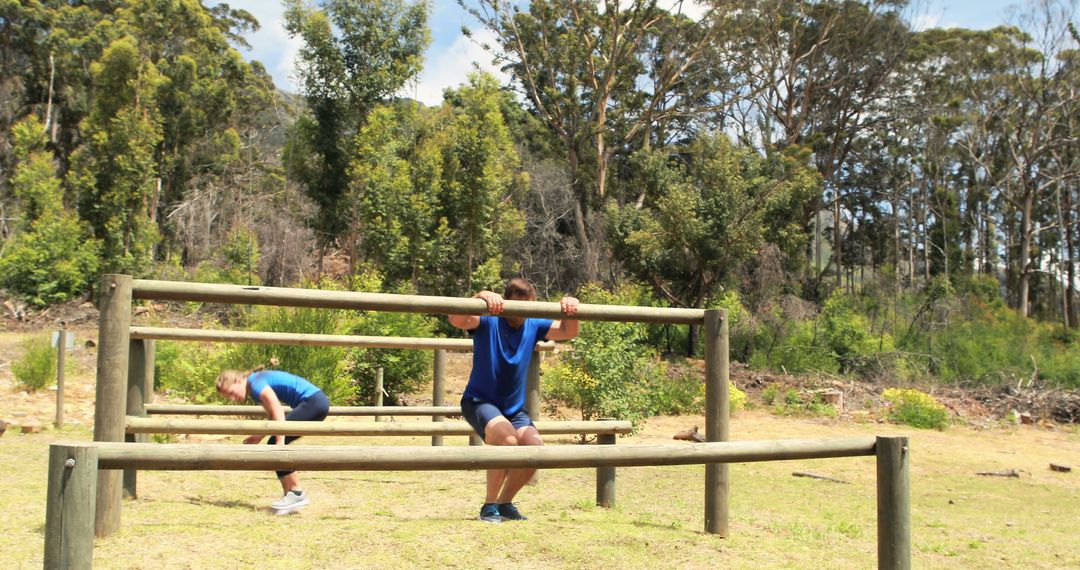 Young People Traversing Wooden Obstacle Course in Nature Park - Free Images, Stock Photos and Pictures on Pikwizard.com