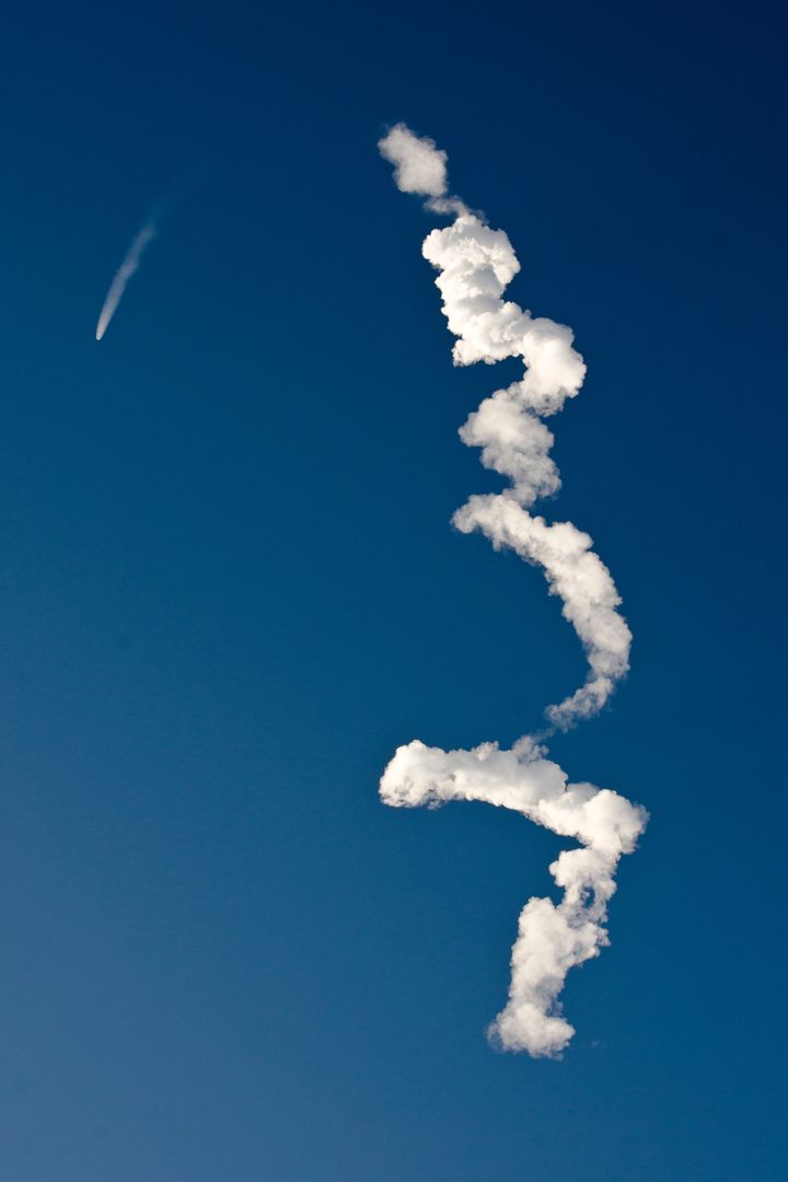 Rocket Launch Trajectory in Clear Blue Sky