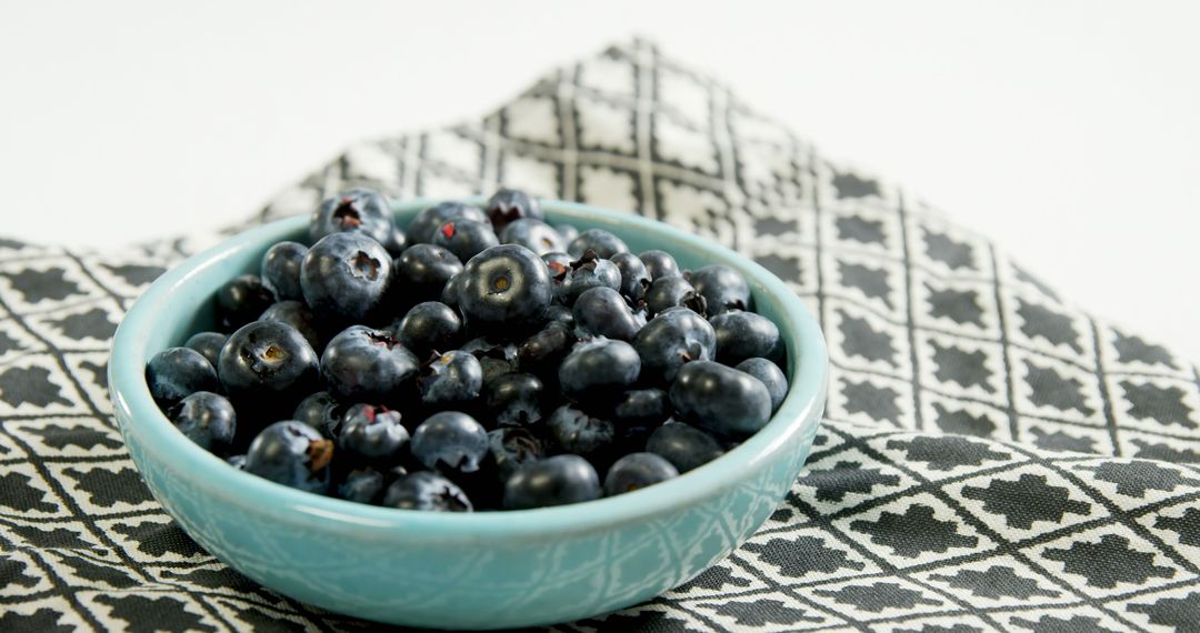 Fresh Blueberry Bowl on Decorated Napkin - Free Images, Stock Photos and Pictures on Pikwizard.com