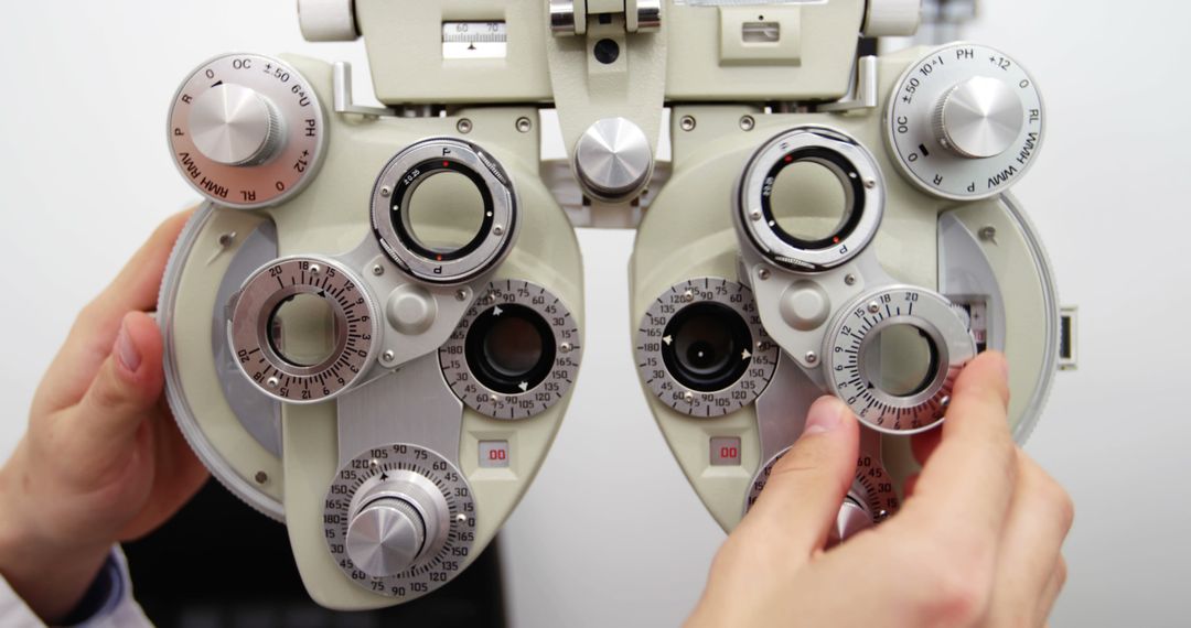 Optometrist Adjusting Phoropter for Eye Examination - Free Images, Stock Photos and Pictures on Pikwizard.com