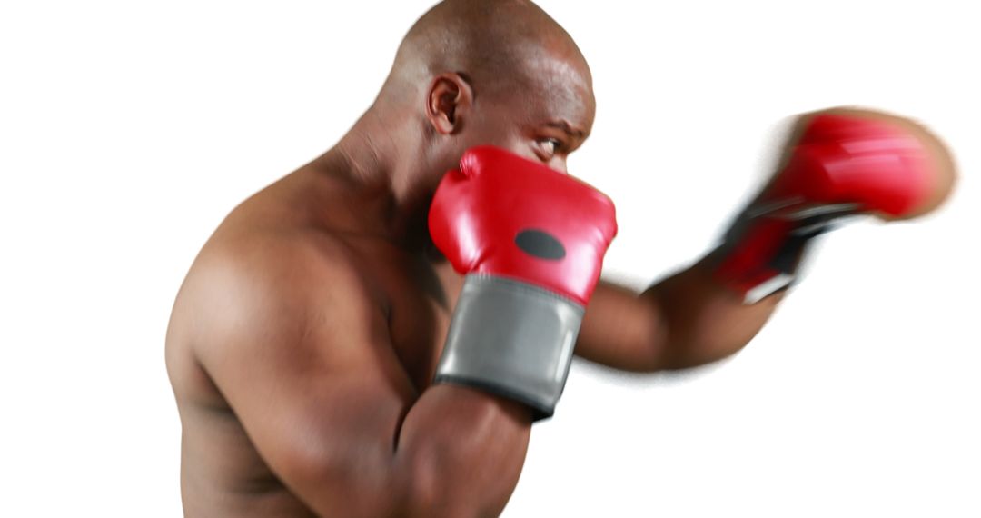 Focused Boxer in Action Throwing Punches Wearing Red Gloves - Free Images, Stock Photos and Pictures on Pikwizard.com