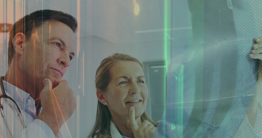 Doctors Analyzing Radiographic Scan in Clinical Setting