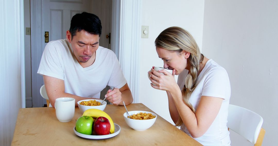 Mixed Ethnicity Couple Enjoying Breakfast at Home
