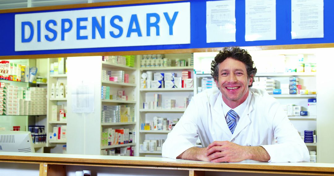 Portrait of pharmacist checking a medicine in pharmacy  - Free Images, Stock Photos and Pictures on Pikwizard.com