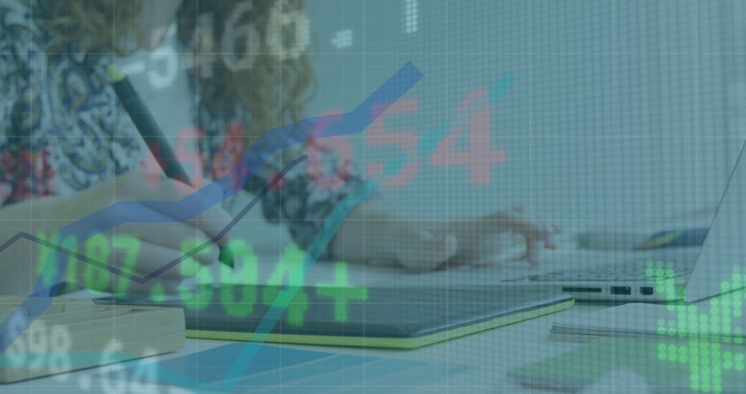 Woman Analyzing Financial Data on Graphic Tablet in Office