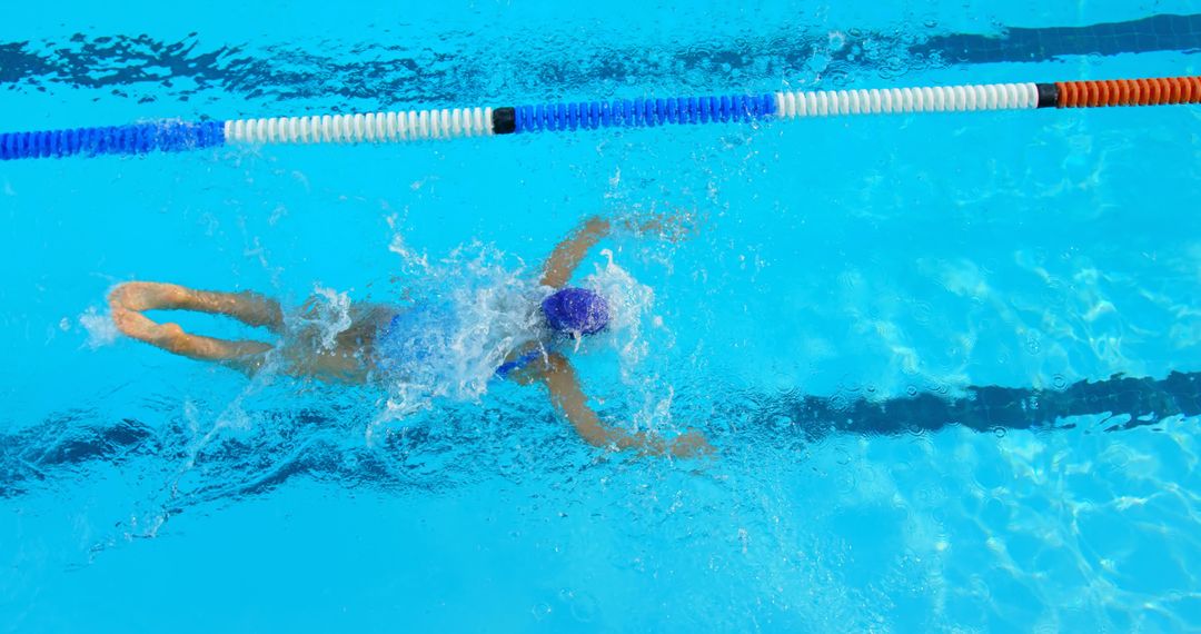 Swimmer Practicing Freestyle Stroke in Outdoor Pool - Free Images, Stock Photos and Pictures on Pikwizard.com