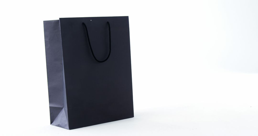 Black Shopping Bag on White Background - Free Images, Stock Photos and Pictures on Pikwizard.com