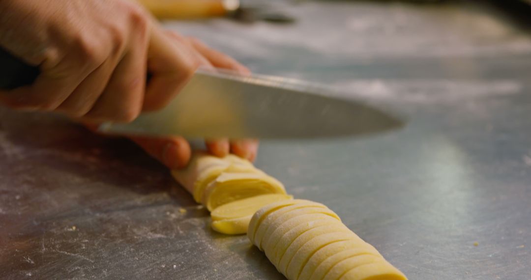 Close-Up of Chef Hands Slicing Dough on Stainless Steel Surface - Free Images, Stock Photos and Pictures on Pikwizard.com