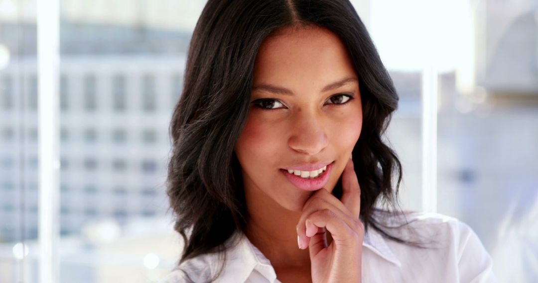 Confident Businesswoman Smiling in Bright Office - Free Images, Stock Photos and Pictures on Pikwizard.com