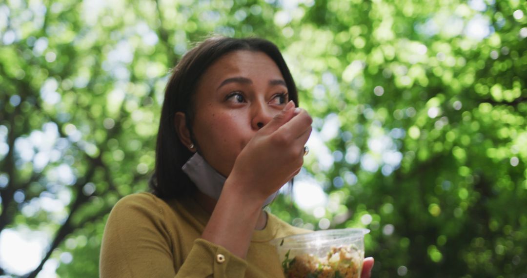 Woman Eating Salad in Park on a Sunny Day - Free Images, Stock Photos and Pictures on Pikwizard.com