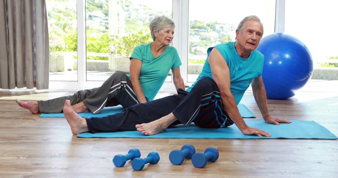 Senior Couple Exercising with Yoga Mats and Dumbbells - Free Images, Stock Photos and Pictures on Pikwizard.com