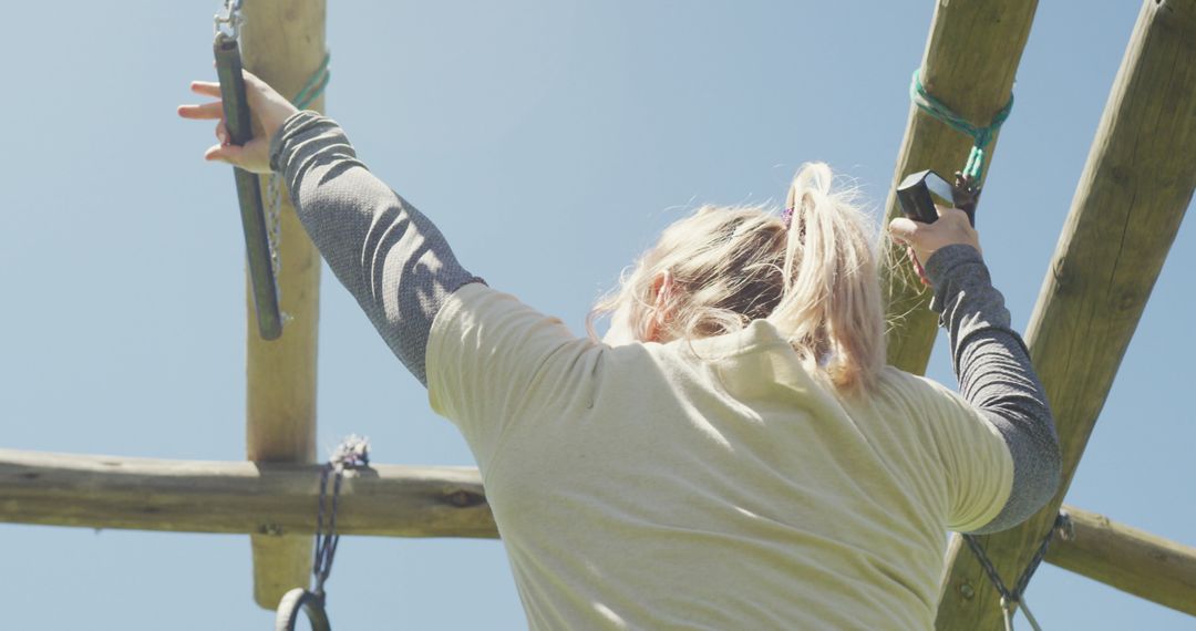 Female Soldier Training on Army Obstacle Course in Sunlight