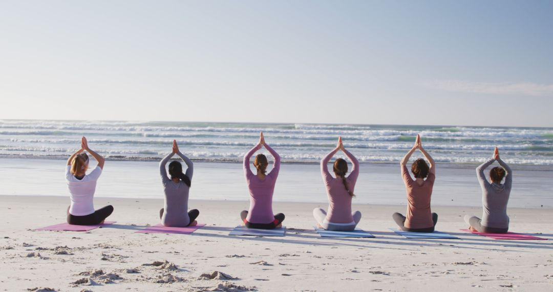 Group Yoga Session on Beach Practicing Meditation Pose at Sunrise - Free Images, Stock Photos and Pictures on Pikwizard.com