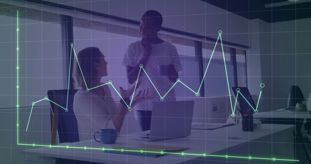 Business Colleagues Analyzing Data in Office with Digital Graph Overlay