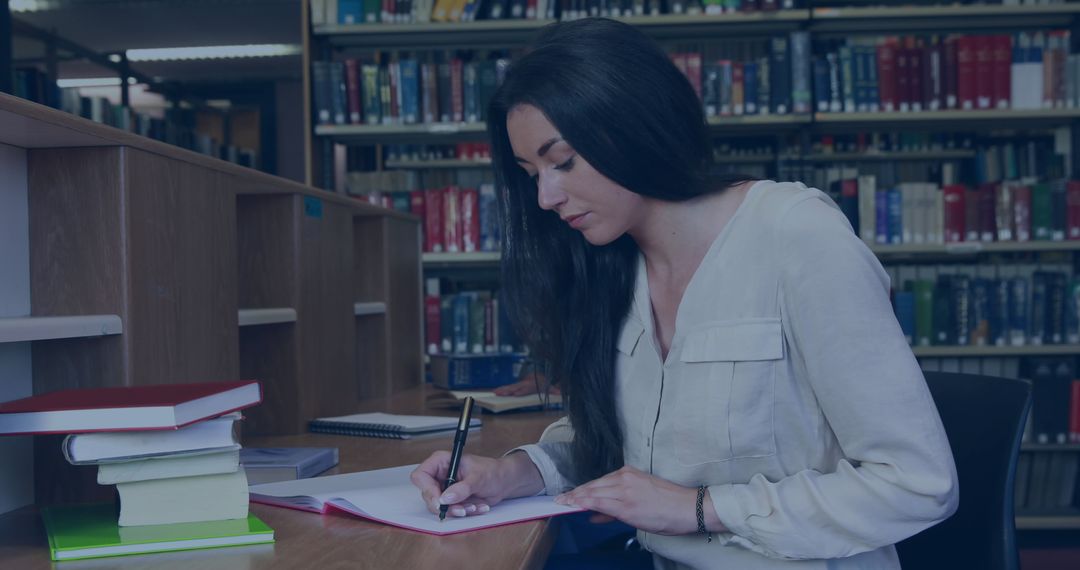 Dedicated Female Student Studying in Library