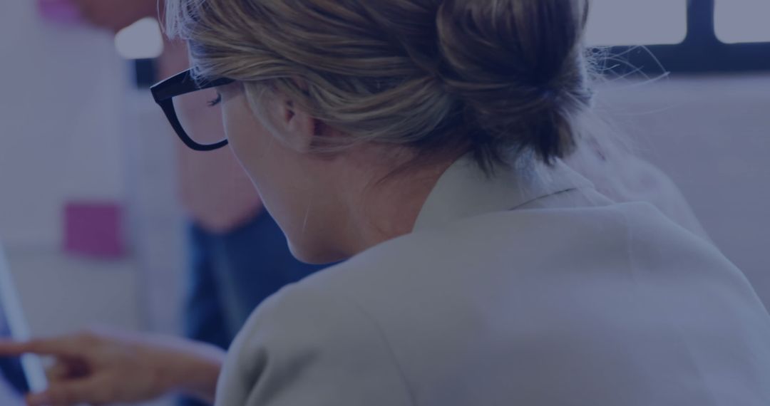 Professional Businesswoman Analyzing Data in Office